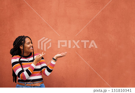 Mockup, happy or black woman with marketing, product placement or branding space on wall background. Smile or African gen z girl advertising discount deal, sales offer or promotion announcement Mockup, happy or black woman with marketing, product placement or branding space on wall background. Smile or African gen z girl advertising discount deal, sales offer or promotion announcement 131810341