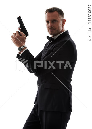 Secret agent man with gun isolated on a white background for law, action movie or security of a criminal businessman. Private detective, professional person crime or actor firearm in studio portrait 131810627