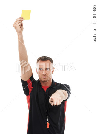 Portrait, foul and yellow card with a soccer referee in studio isolated on a white background for rules. Football, call and warning with a male ref giving a booking during a competitive sports match 131810685