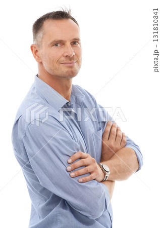 Confidence, pride and portrait of a man in a studio posing with crossed arms for leadership. Happy, smile and face of a confident mature male model with positive mindset isolated by white background. Confidence, pride and portrait of a man in a studio posing with crossed arms for leadership. Happy, smile and face of a confident mature male model with positive mindset isolated by white background. 131810841