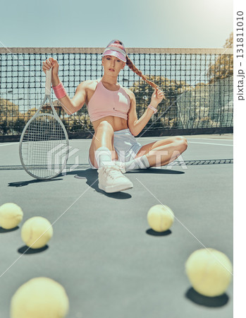 Portrait, tennis sports and woman on court with racket after workout, training or exercise. Fashion, fitness balls or female athlete sitting, resting or relax on stadium outdoors after match or game Portrait, tennis sports and woman on court with racket after workout, training or exercise. Fashion, fitness balls or female athlete sitting, resting or relax on stadium outdoors after match or game 131811010