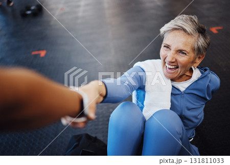 Senior woman, fitness and personal trainer with support and happy workout, exercise and muscle health on gym floor. Helping hand, coaching and elderly person with training sports for retirement care Senior woman, fitness and personal trainer with support and happy workout, exercise and muscle health on gym floor. Helping hand, coaching and elderly person with training sports for retirement care 131811033
