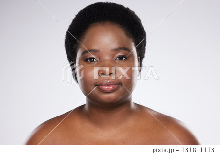 Black woman, skincare beauty and studio portrait with healthy skin glow, wellness and happy for self care. Isolated african model, cosmetics and makeup for dermatology, aesthetic and facial health Black woman, skincare beauty and studio portrait with healthy skin glow, wellness and happy for self care. Isolated african model, cosmetics and makeup for dermatology, aesthetic and facial health 131811113