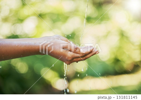 Hands, water and sustainability or cleaning for hydration, wash or hygiene in care, splash and wellness in nature. Hand of person washing in clean natural aqua liquid to prevent germs or remove dirt Hands, water and sustainability or cleaning for hydration, wash or hygiene in care, splash and wellness in nature. Hand of person washing in clean natural aqua liquid to prevent germs or remove dirt 131811145