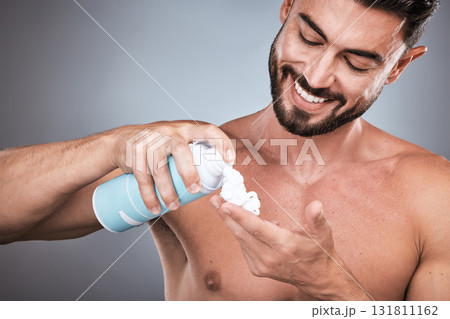 Hands, shaving cream and man with product in studio isolated on a gray background for hair removal. Skincare, face and happy male model with facial foam to shave for epilation, health and hygiene. 131811162