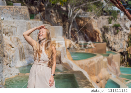 Female tourist exploring Grutas Tolantongo in Mexico, enjoying natural hot springs, scenic caves, and outdoor adventure. Travel, wellness, and sightseeing concept 131811182