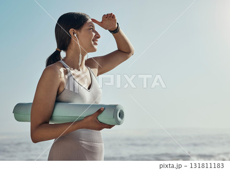 Fitness, peace and yoga mat by woman at the beach for exercise, balance and cardio on blue sky background. Meditation, training and girl relax at the ocean for wellness, peace and zen at the sea Fitness, peace and yoga mat by woman at the beach for exercise, balance and cardio on blue sky background. Meditation, training and girl relax at the ocean for wellness, peace and zen at the sea 131811183