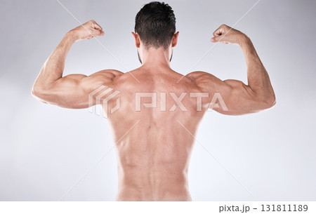 Fitness, back or man flexing muscle after exercise, training or gym workout for body goals target. Sports motivation, progress or healthy bodybuilder athlete with biceps muscles isolated in studio Fitness, back or man flexing muscle after exercise, training or gym workout for body goals target. Sports motivation, progress or healthy bodybuilder athlete with biceps muscles isolated in studio 131811189