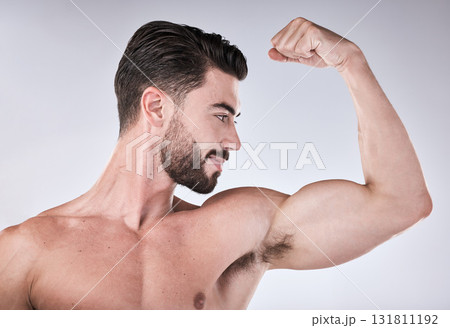 Arm muscle, strong man and body, face profile with health and fitness, muscular person isolated on studio background. Skin, bodybuilder and biceps, wellness and weightlifting exercise and growth 131811192