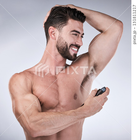 Skincare, spray and man with smile, perfume and deodorant for wellness on grey studio background. Hygiene for arm pit, male and gentleman with fragrance, freshness and grooming routine on backdrop Skincare, spray and man with smile, perfume and deodorant for wellness on grey studio background. Hygiene for arm pit, male and gentleman with fragrance, freshness and grooming routine on backdrop 131811217