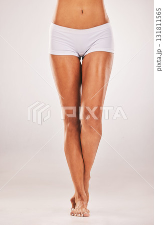 Legs, woman and beauty in studio for skin, cosmetics and grooming against white background space. Feet, smooth and leg of girl model relax on mockup for smooth, perfect and luxury skincare isolated Legs, woman and beauty in studio for skin, cosmetics and grooming against white background space. Feet, smooth and leg of girl model relax on mockup for smooth, perfect and luxury skincare isolated 131811565