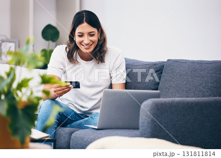 Ecommerce, laptop or woman with credit card happy with digital payment while relaxing on sofa at home. Smile, finance or girl excited with online shopping subscription discount, sales offer or deal Ecommerce, laptop or woman with credit card happy with digital payment while relaxing on sofa at home. Smile, finance or girl excited with online shopping subscription discount, sales offer or deal 131811814