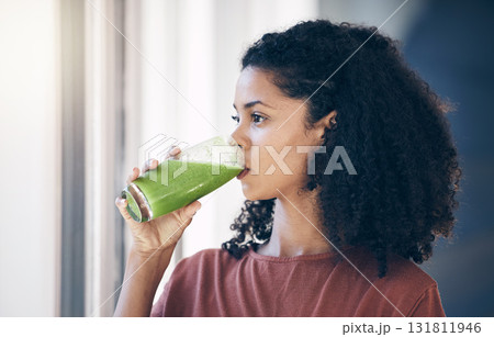 Healthy, protein and woman drinking a smoothie for weight loss, energy and breakfast while thinking. Food, health and girl with a juice cocktail for nutrition idea, green detox and vegan lifestyle 131811946