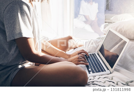Hands, laptop and typing in bed in bedroom for social, media or internet browsing in the morning. Digital technology, remote worker and woman working on project, writing email or research on computer Hands, laptop and typing in bed in bedroom for social, media or internet browsing in the morning. Digital technology, remote worker and woman working on project, writing email or research on computer 131811998
