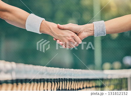 Hand, tennis and handshake for partnership, trust or greeting in sportsmanship over net on the court. Players shaking hands before sports game, match or unity for deal or agreement in solidarity Hand, tennis and handshake for partnership, trust or greeting in sportsmanship over net on the court. Players shaking hands before sports game, match or unity for deal or agreement in solidarity 131812152