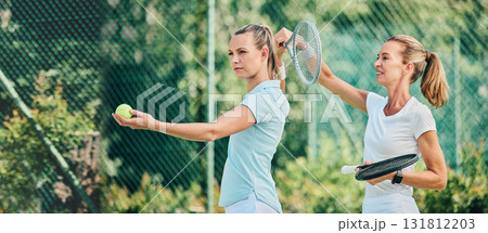 Tennis training, sport and women together on outdoor turf, instructor or coach with fitness, motivation and help. Exercise, sports lesson and athlete workout, teaching and learning skill on court 131812203