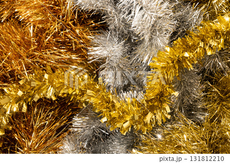 Golden and silver tinsel Christmas tree bokeh background. Christmas and New Year celebrations, holidays design 131812210