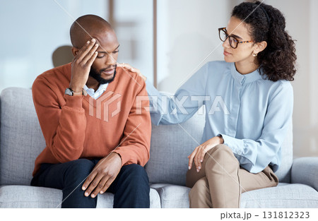 Therapy, counselling and mental health support for black man patient on psychologist couch. Person talking to woman therapist about psychology, anxiety and depression or stress for help or support Therapy, counselling and mental health support for black man patient on psychologist couch. Person talking to woman therapist about psychology, anxiety and depression or stress for help or support 131812323