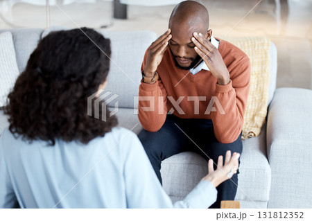 Black man, mental health and counseling with woman psychologist, stress headache and depression with help. Consultation, doctor with patient and conversation about anxiety problem, sad and depressed Black man, mental health and counseling with woman psychologist, stress headache and depression with help. Consultation, doctor with patient and conversation about anxiety problem, sad and depressed 131812352