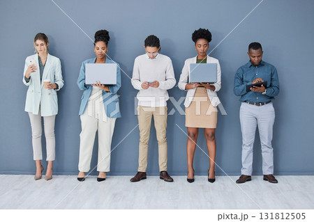 Business people, waiting or technology in job interview queue, recruitment line or hr row on wall. Diversity, men or women in human resources, hiring or onboarding office on phone, laptop or tablet 131812505