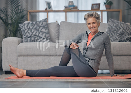 Portrait, yoga and fitness with a senior woman in her home for mental health, wellness or spiritual zen. Exercise, floor and workout with a mature female doing pilates training in the living room 131812601