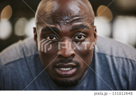 Face, portrait and sweating black man tired after exercise, workout or training resting after exercising in gym. Sports break, wellness and male athlete from Nigeria with fatigue, exhausted and sweat Face, portrait and sweating black man tired after exercise, workout or training resting after exercising in gym. Sports break, wellness and male athlete from Nigeria with fatigue, exhausted and sweat 131812648