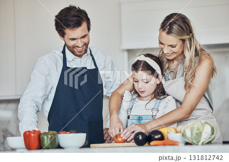Learning, parents or girl cooking vegetables as a happy family in a house kitchen with organic food for dinner. Development, father or mother teaching, helping or cutting tomato with a healthy child Learning, parents or girl cooking vegetables as a happy family in a house kitchen with organic food for dinner. Development, father or mother teaching, helping or cutting tomato with a healthy child 131812742