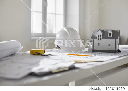 Close up photo of blueprint of architectural plan with house layout, helmet and engineer tools. Close up photo of blueprint of architectural plan with house layout, helmet and engineer tools. 131813059