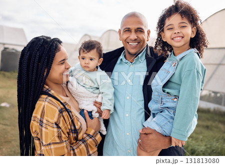Mother, dad and children in portrait at farm, outdoor and happy for baby kid, growth and sustainable small business. Black family, kids and smile for farming sustainability with love by greenhouse Mother, dad and children in portrait at farm, outdoor and happy for baby kid, growth and sustainable small business. Black family, kids and smile for farming sustainability with love by greenhouse 131813080