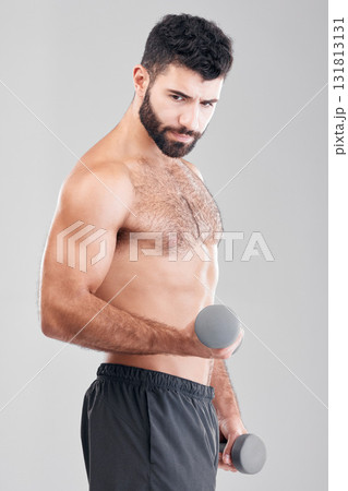 Man, fitness and exercise with dumbbells in studio isolated on a gray background. Sports thinking, training and male bodybuilder with strong muscles weight lifting, workout or bodybuilding for power. 131813131