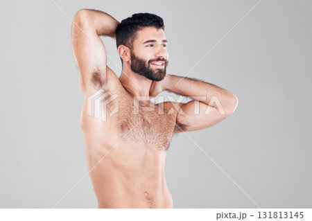 Fitness, muscles and sexy man in a studio after a bodybuilding workout or sport training. Health, wellness and muscular male model flexing his biceps while posing isolated by a gray background. Fitness, muscles and sexy man in a studio after a bodybuilding workout or sport training. Health, wellness and muscular male model flexing his biceps while posing isolated by a gray background. 131813145
