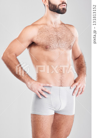 Body, underwear and model with a man in studio on a gray background for health, fitness or wellness. Exercise, stomach and underpants with a male posing in studio to promote a healthy lifestyle Body, underwear and model with a man in studio on a gray background for health, fitness or wellness. Exercise, stomach and underpants with a male posing in studio to promote a healthy lifestyle 131813152