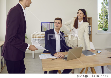 Business people at work in office on workplace. Company employees analyzing company on meeting. Business people at work in office on workplace. Company employees analyzing company on meeting. 131815345