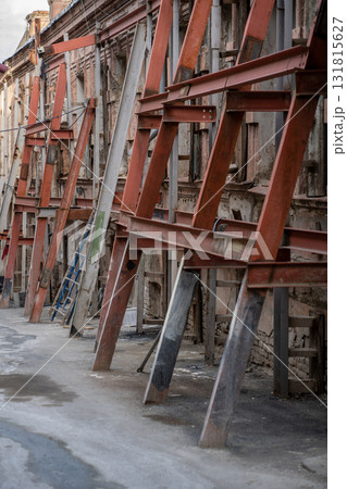 Prevention of destruction metal wall supports old building what need major repairs reconstruction. Prevention of destruction metal wall supports old building what need major repairs reconstruction. 131815627