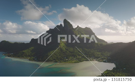 Capturing breathtaking drone of majestic mount Otemanu rising above lush greenery and turquoise waters in Bora Bora, showcasing an idyllic tropical paradise. Travel vacation concept background 131815750
