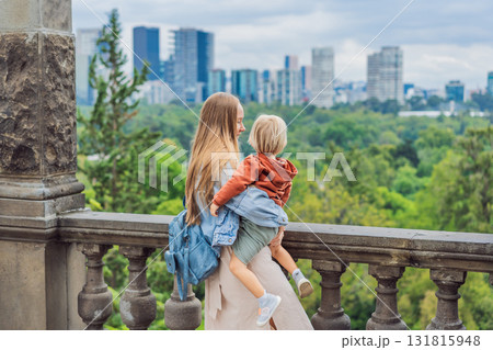 Mother with her young son near Chapultepec Castle in Mexico City, enjoying a cultural family trip. Parenthood, love, heritage sightseeing, and family bonding travel concept 131815948