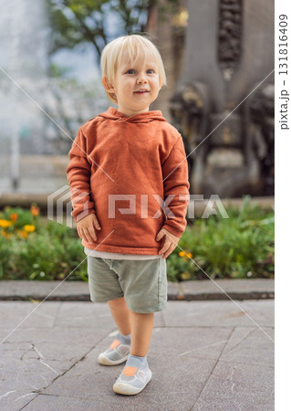 Little toddler tourist near Chapultepec Castle in Mexico City, exploring the landmark during family travel. Cultural heritage and tourism concept Little toddler tourist near Chapultepec Castle in Mexico City, exploring the landmark during family travel. Cultural heritage and tourism concept 131816409