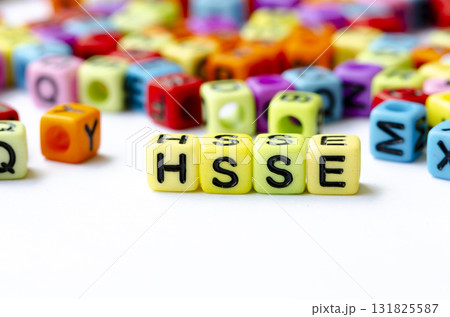 Close up of HSSE text on yellow cubes representing Health, Safety, Security and Environment. Health and Safety concept. Close up of HSSE text on yellow cubes representing Health, Safety, Security and Environment. Health and Safety concept. 131825587