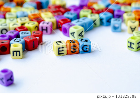 Side view of ESG text on multicolored cube representing Environmental, Social, and Governance. Conservation concept. Side view of ESG text on multicolored cube representing Environmental, Social, and Governance. Conservation concept. 131825588