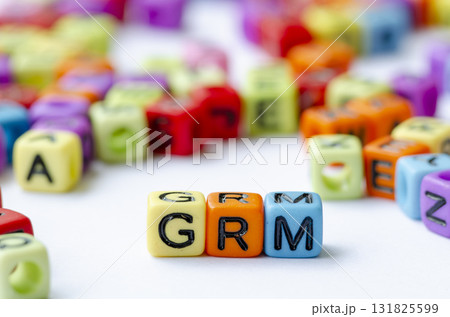 Close up of GRM text on multicolored cubes representing Grievance Redress Mechanism. Conservation concept. Close up of GRM text on multicolored cubes representing Grievance Redress Mechanism. Conservation concept. 131825599