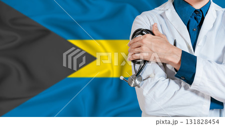 Bahamas healthcare concept. Doctor with stethoscope on Bahamas flag. Doctor holding stethoscope on Bahamian flag Bahamas healthcare concept. Doctor with stethoscope on Bahamas flag. Doctor holding stethoscope on Bahamian flag 131828454