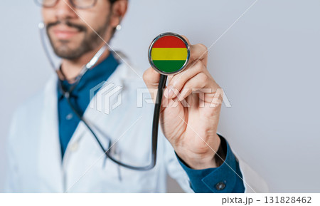 Doctor holding stethoscope with Bolivia flag. Bolivia health and care concept. Bolivia flag on stethoscope Doctor holding stethoscope with Bolivia flag. Bolivia health and care concept. Bolivia flag on stethoscope 131828462