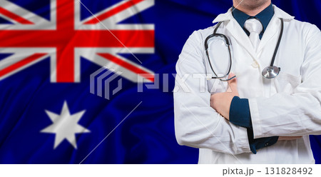 Male doctor with stethoscope on Australia flag. Doctor holding stethoscope on Australia flag 131828492