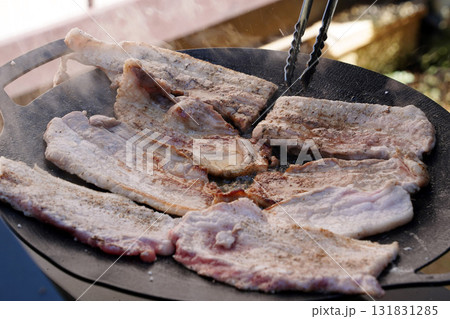 Sizzling Korean BBQ Pork Belly (Samgyeopsal) on a Hot Griddle Sizzling Korean BBQ Pork Belly (Samgyeopsal) on a Hot Griddle 131831285
