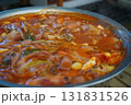 Korean Army Stew (Budae Jjigae) Boiling in a Large Pot 131831526