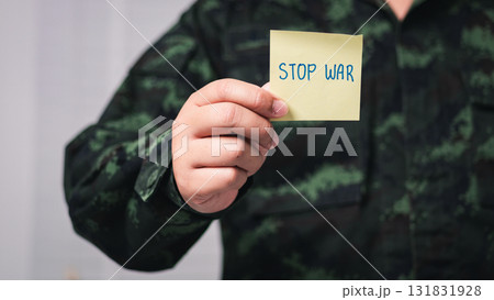 Soldier advocates for peace war zone indoor front view emotional message 131831928