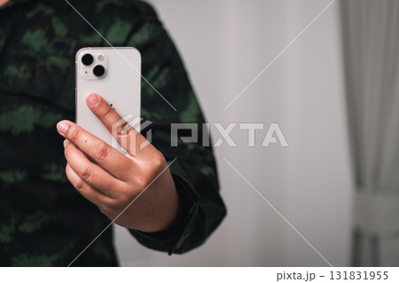 Capturing moments smartphone selfie cozy indoor setting with natural lighting 131831955