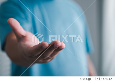 Hand reaching for connection indoor space gesture modern environment close-up human interaction Hand reaching for connection indoor space gesture modern environment close-up human interaction 131832032