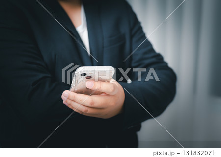 Mobile phone interaction urban setting candid focused environment close-up view daily life concept 131832071