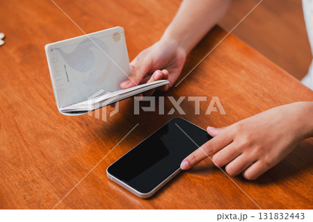 Smartphone and wallet interaction modern home lifestyle image cozy environment close-up perspective daily routines 131832443